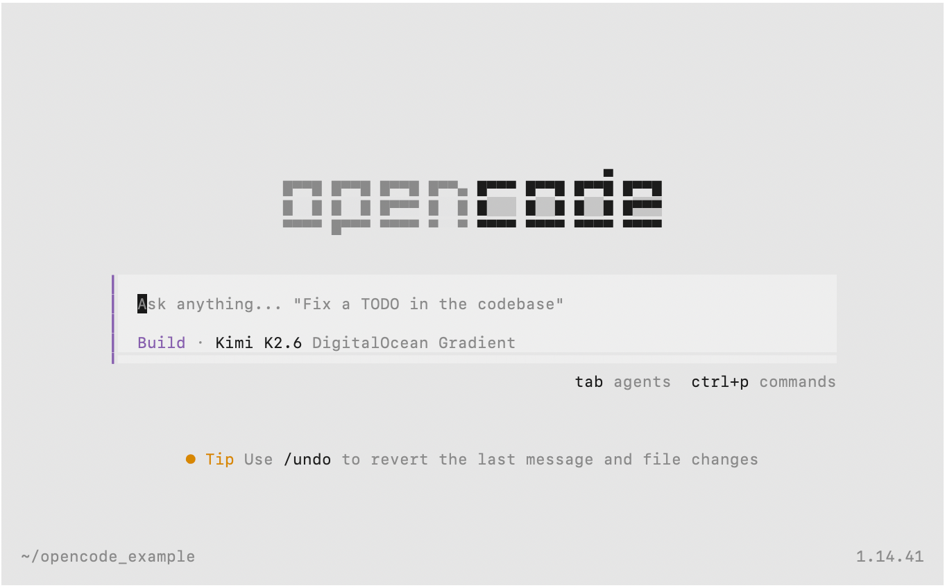 The OpenCode terminal user interface showing a split-pane layout with a conversation panel on the left displaying the agent's responses and file edits, and a scrollable session view, with a prompt input field at the bottom for entering coding tasks